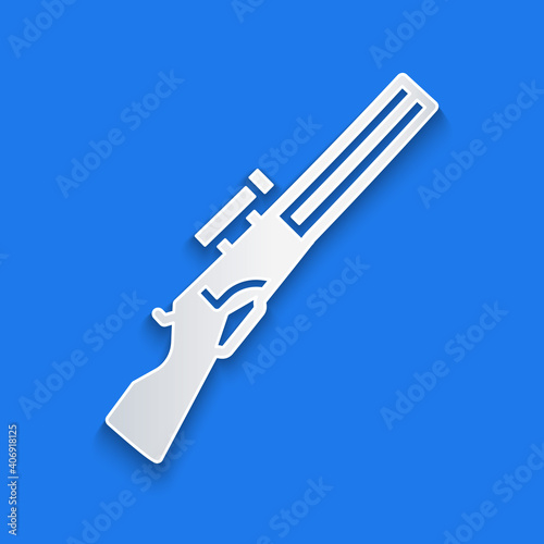 Paper cut Hunting gun icon isolated on blue background. Hunting shotgun. Paper art style. Vector.