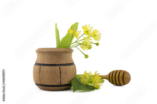 Wooden pot of freshly picked yellow linden flowers