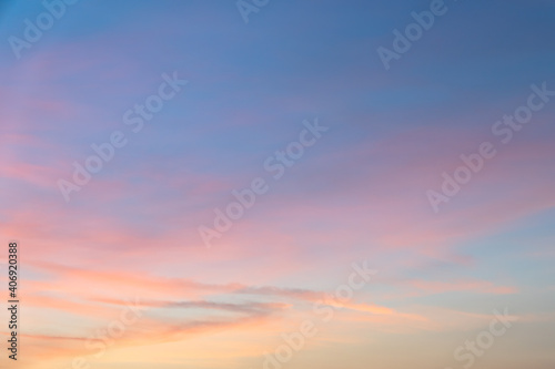 Beautiful pastel sky with golden clouds pattern in a holiday evening for background or wallpaper. Sunset sky. Twilight scene.