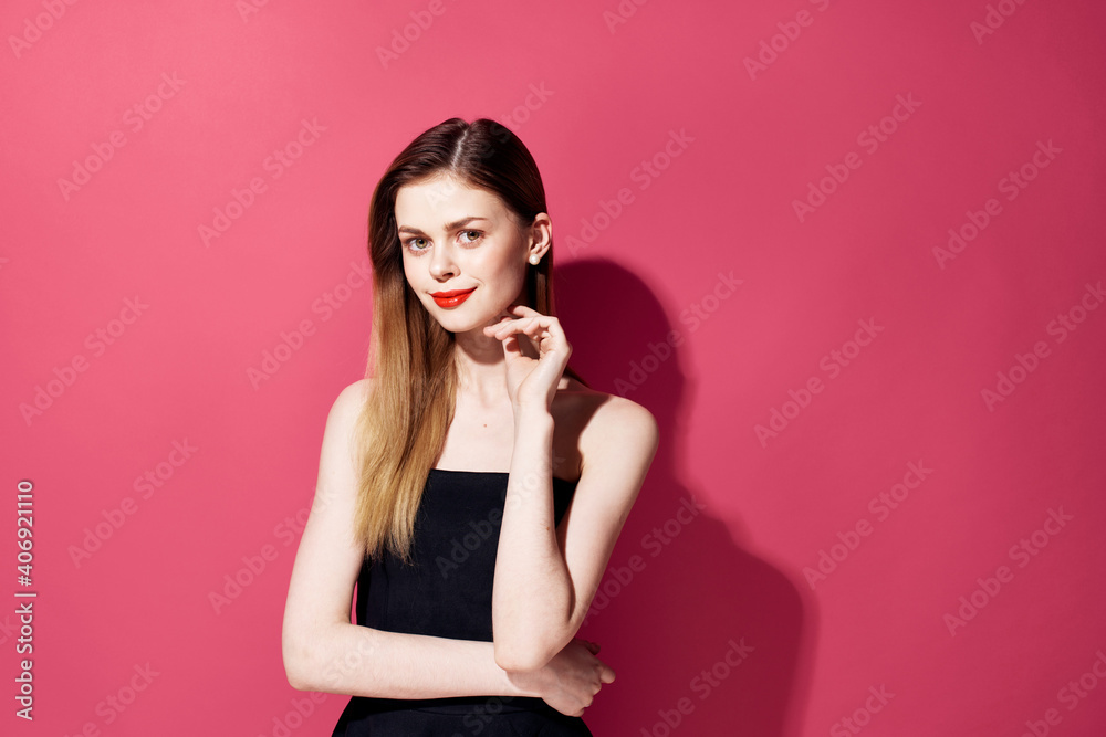 Beautiful glamor woman red lips decoration black dress pink background Beautiful glamor woman red lips decoration black dress pink background