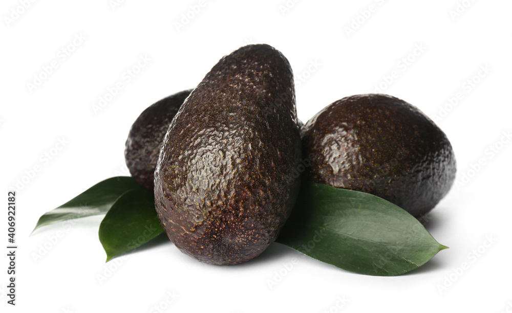 Delicious ripe hass avocadoes and green leaves on white background Delicious ripe hass avocadoes and green leaves on white background