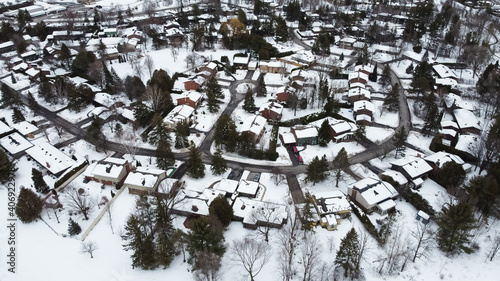 Aerial of the Kanata neighborhood in winter. Suburbian houses covered with snow. Kanata, Ottawa, Ontario, Canada