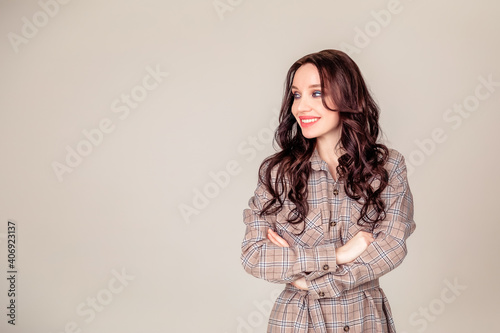 portrait of a beautiful young brunette with long hair. businesswoman