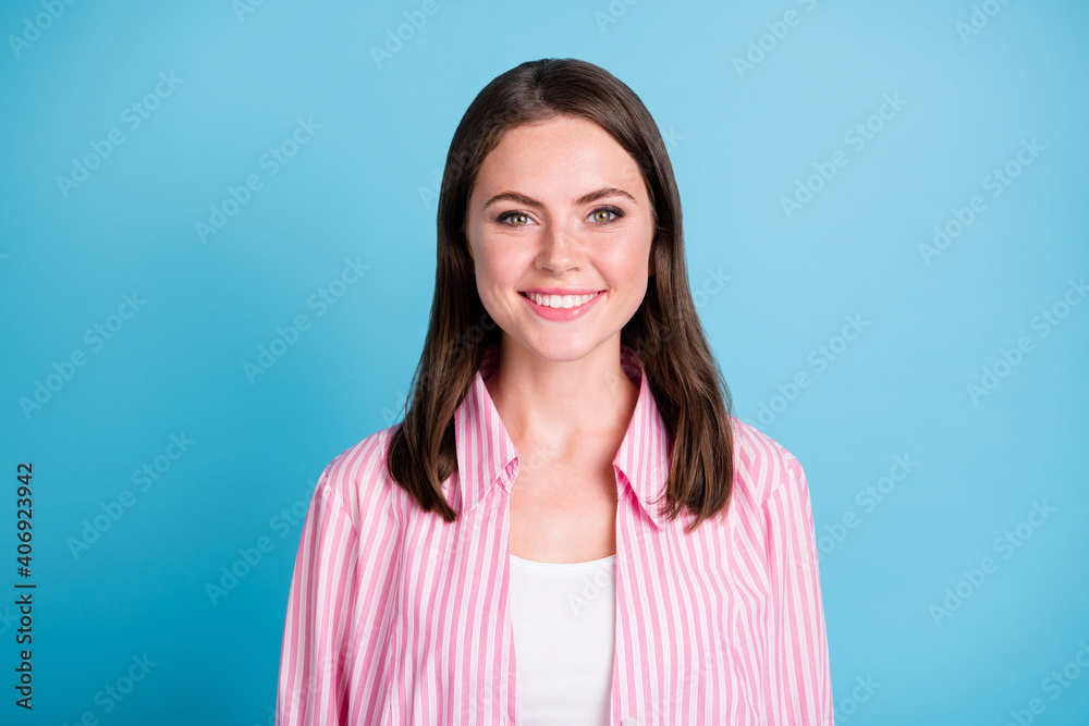 Photo portrait of smiling woman isolated on pastel blue colored background Photo portrait of smiling woman isolated on pastel blue colored background