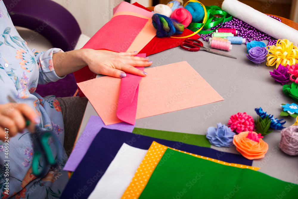 Fototapeta premium Woman modelling artificial flower from clay