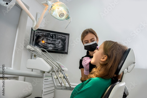 dentist doing procedure patient in dentist office