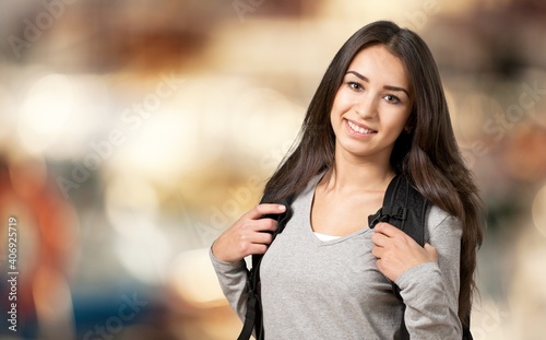 Young smile student girl on blurred background
