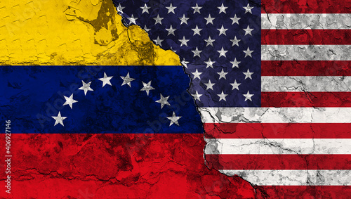 Concept of a Conflict between the United States of America and Venezuela with painted flags on a wall with a crack