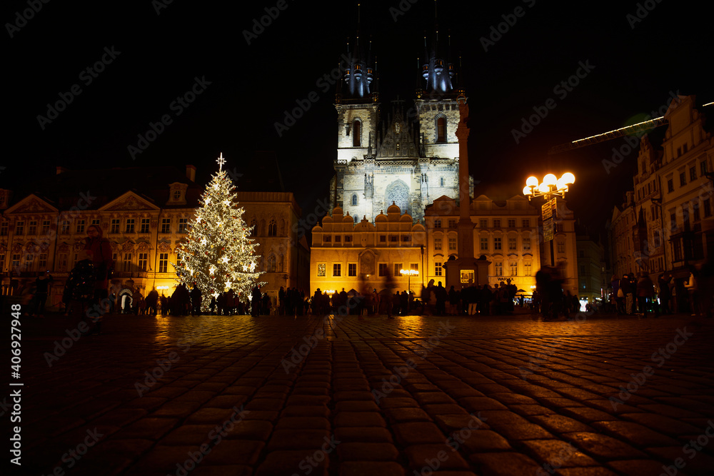 Fototapeta premium Prague, Czech Republic - January 1 2021: Nearly empty Old Town Square with Christmas decorations. Few tourists are visiting this place due to Covid-19 restrictions 