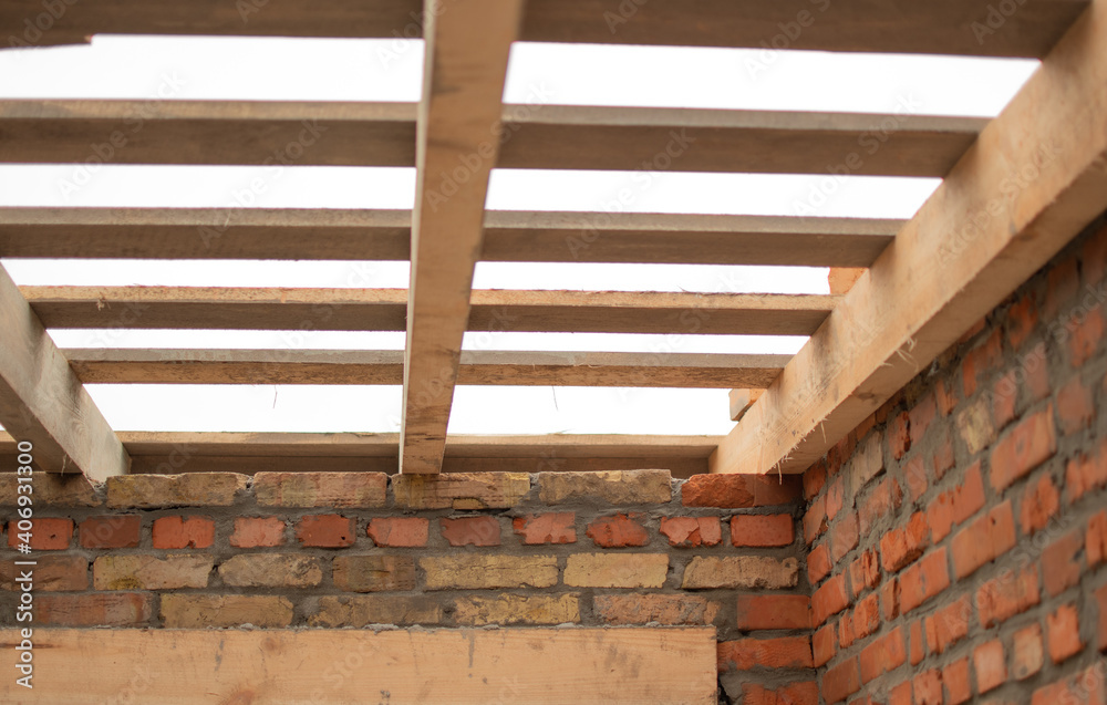 Rafter system. Wooden floor on the roof. Arrangement of wooden posts ...