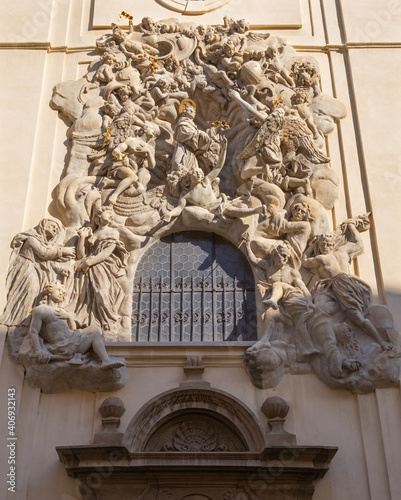 PRAGUE, CZECH REPUBLIC - OCTOBER 18, 2018: Baroque relief of St. Anthony of Padua over the side entry of Bazilika Svatého Jakuba Většího (James the Greater) by Ottavio Mosto (1695 -1701).