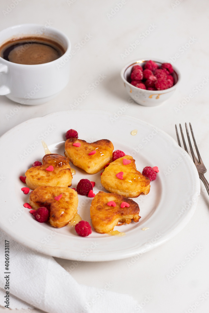 Breakfast on Valentine's Day - cheesecakes in the shape of hearts. Breakfast on Valentine's Day - cheesecakes in the shape of hearts.