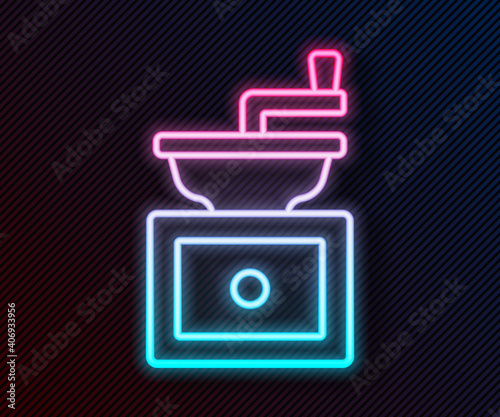 Glowing neon line Manual coffee grinder icon isolated on black background. Vector.