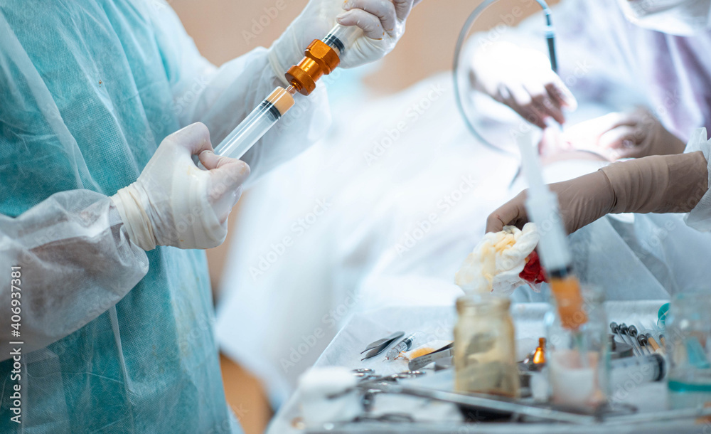 liposuction and lipofilling concept, surgery in the operating room - fat cell transplant.