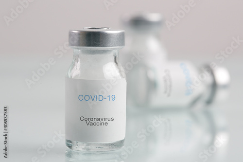 Corona Virus vaccine bottles. Vaccination, immunization, treatment to cure Covid 19 infection. Healthcare And Medical concept.