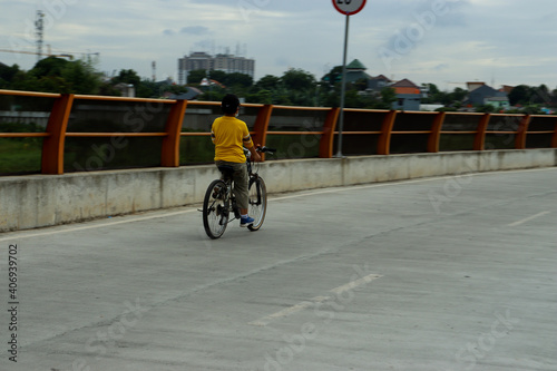 Cycling in a ride-free area in the Lagoon area, Bekasi, West Java.