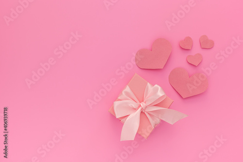 Valentines day composition: one pink gift boxes with ribbon