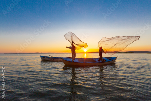 Net fishermen and the sunset / ulubat Lake photo