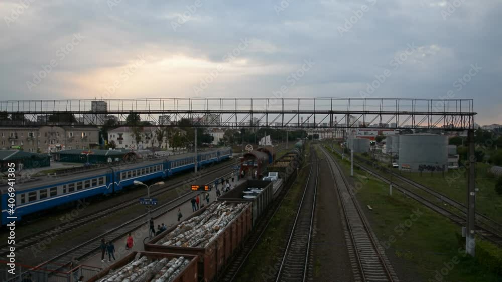 Freight train moves on the railroad in the evening Freight train moves on the railroad in the evening