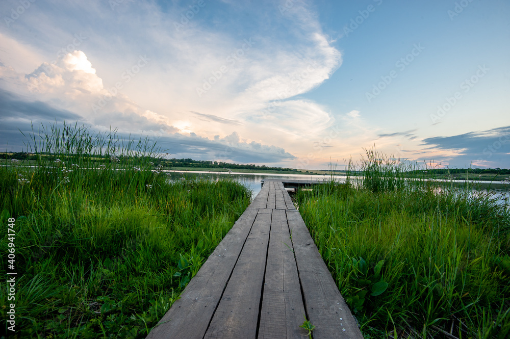 Fototapeta premium Wooden platform along the lake.