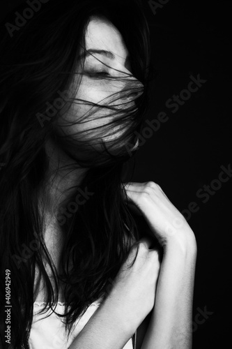 Emotional Sensual black and white portrait of a beautiful girl on a dark background