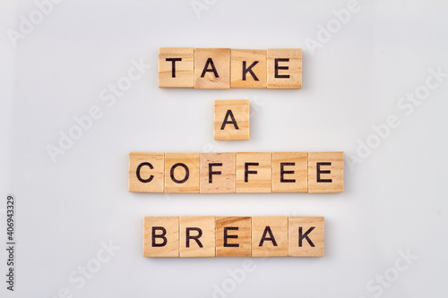 Take a coffee break text on cubes. Time to relax and stop the work. Isolated on white background.