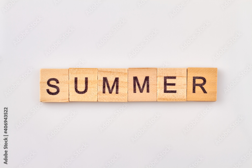 Summer word written in wooden cubes. Concept of season isolated on white background. Summer word written in wooden cubes. Concept of season isolated on white background.