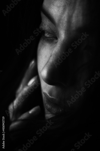 Emotional Sensual black and white portrait of a beautiful girl on a dark background