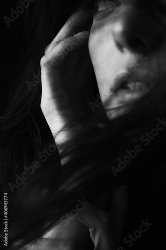 Emotional Sensual black and white portrait of a beautiful girl on a dark background