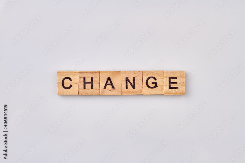 Change written with wooden blocks. Conceptual quote of improvement yourself. Isolated on white background. Change written with wooden blocks. Conceptual quote of improvement yourself. Isolated on white background.