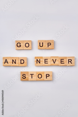 Advise for success life. Motivetional phrase written with wooden blocks. Isolated on white background.