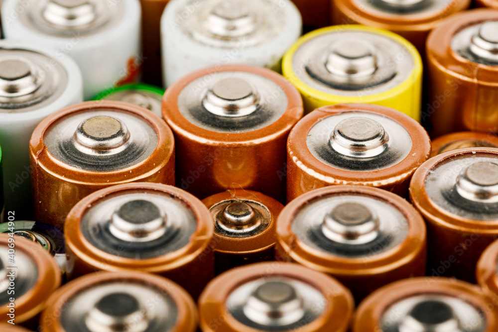Isolated old battery leakage, hazardous waste concept. Energy abstract background of colorful batteries. Isolated old battery leakage, hazardous waste concept. Energy abstract background of colorful batteries.