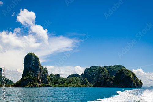 Beautiful landscape with islands in the Adaman Sea with azure water and sky with clouds. Thailand
