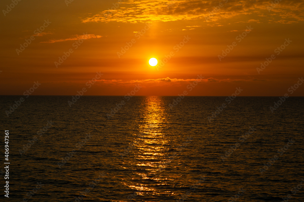 Beautiful sunset above the sea The setting sun over the ocean