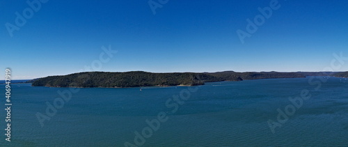 Beautiful panoramic view of a deep blue sea, small Lion island, West Head and Barrenjoey Lighthouse, Warrah Lookout, Brisbane Water National Park, New South Wales, Australia 