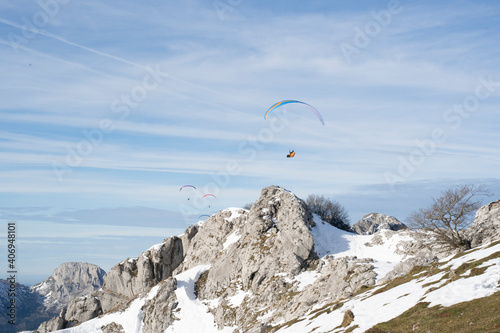 paragliders flying over the mountains 