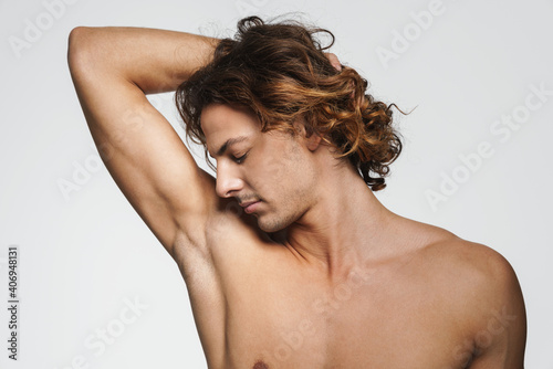 Sensual shirtless guy posing and showing his armpit