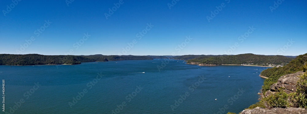 Beautiful panoramic view of a deep blue sea, small Lion island, West Head and Barrenjoey Lighthouse, Warrah Lookout, Brisbane Water National Park, New South Wales, Australia
