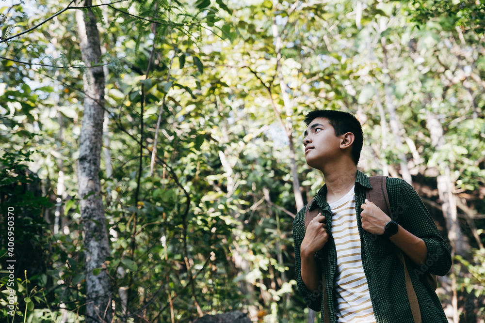 Asian teenager hike through forest to peak of mountain. Asian teenager hike through forest to peak of mountain.