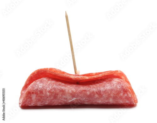 Salami slice for sandwich rolled and served with toothpick isolated on white background, round fermented red meat pieces