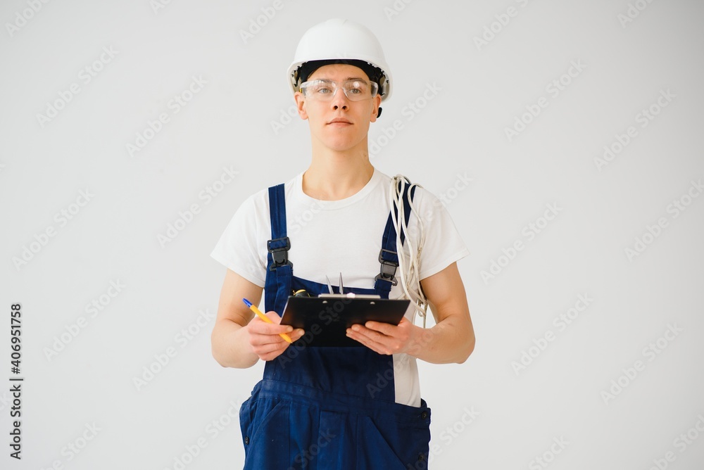 Builder in helmets on a white background Builder in helmets on a white background