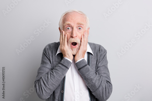 Portrait of old white hair impressed man hands face open mouth wear dark sweater isolated on grey background