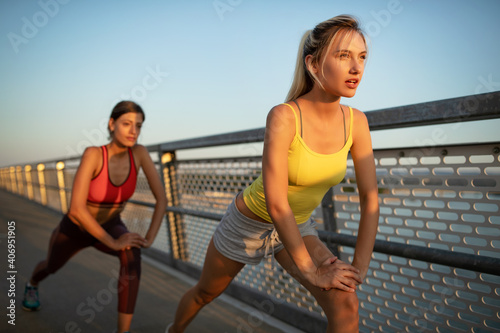Beautiful women working out in a city. Running, jogging, exercise, people, sport concept