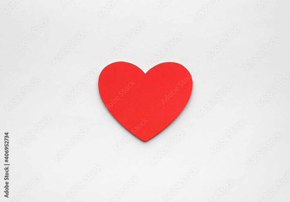 Red paper heart on white background