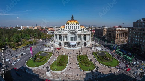 Daytime time lapse view of historical landmark Palace of Fine Arts (Spanish: Palacio de Bellas Artes ) in the Historic Center of Mexico City, Mexico. photo