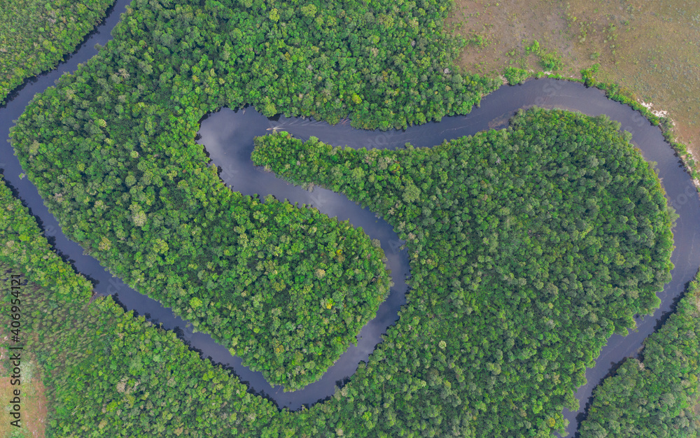 Fototapeta premium Beautiful natural scenery of river in southeast Asia tropical green forest with mountains in background, aerial view drone shot