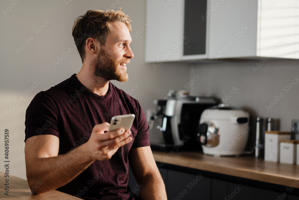 Handsome young man using mobile phone Handsome young man using mobile phone