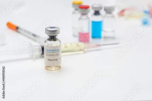 Close up Corona Virus(COVID-19) vaccine bottle with syringe injection in Laboratory