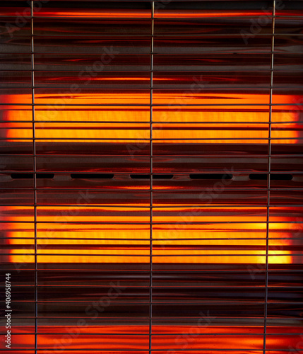 infrared heating elements of an electric heater with protective grid
