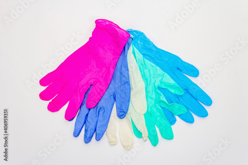 Assorted of glamour surgical gloves isolated on white background © FuzullHanum